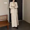 Conjunto de tres piezas para mujer de alta gama, suave y elegante, de corte slim, para otoño e invierno, transfronterizo europeo y americano, con camisola, cárdigan y top de manga larga