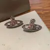 Brincos Saturno Clássicos com Diamantes Inteiros Estilo Nana Rainha Mãe Britânica Teresa para Mulheres, Finamente Trabalhados com um Toque de Luxo, Brincos Planeta de Nicho