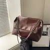 2026 Moda Retrô Simples Bolsa Tote Casual Feminina Grande Capacidade Primavera Novo Estilo Bolsa de Ombro Texturizada
