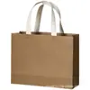 Bolsa de papel kraft empaque tienda de ropa para mujer bolso de mano regalo de maquillaje logo impreso personalizado franqueo de punto personalizado