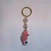Colgante de Serie Ojo de Diablo Transfronterizo Europeo y Americano Colgante de Llavero de Joyería de Animales Ojo de Hueso con Goteo de Aceite Accesorios de Aleación para Mujeres