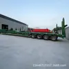 Fabricante exporta semirreboque de piso baixo, semirreboque de transporte de prancha para máquina de gancho de 4 eixos, pescoço de ganso baixo-plataforma plana com suportes de leque alargados