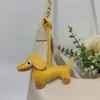 Colgante de Perro Salchicha Nuevo Transfronterizo Dibujos Animados Colgante de Bolsa de Cachorro de Cuero Accesorios para Funda de Teléfono Móvil Accesorios Creativos para Coche