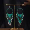 Joyas populares europeas y americanas fuente transfronteriza estilo étnico bohemio retro pendientes largos de borla de cuentas de arroz para mujer