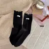 Artículo recomendado del puesto de Hangzhou calcetines de encaje hechos a mano estilo coreano hasta la pantorrilla para mujer color liso algodón calcetines holgados primavera y otoño nuevos versátiles