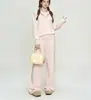 Conjunto casual de punto de color liso para mujer, nueva colección otoño/invierno 2026, con un suéter de media cremallera y pantalones de pierna ancha de cintura alta, un conjunto de dos piezas