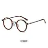 Antitormenta negra con montura de gafas de moda retro para hombre, montura redonda, estilo punk, metal, luz anti-azul, espejo plano al por mayor