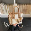 Bolsas Texturizadas de Moda para Mujer Este Año 2026 Bolsos Cruzados de Nicho de Verano con Diseño Elegante y Bolsos de Mano Tipo Cubo a la Moda