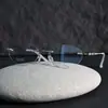M0053 Nuevas Gafas Ultraligeras Look Natural para Hombre y Mujer Gama Alta Puro Deseo Montura Retro Sin Marco de Titanio Marco de Gafas Fábrica de Danyang