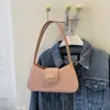 Bolso de axila de nicho estilo francés 2026 nuevo modelo bolso de mano simple bolso de hombro de moda bolso cruzado bolso pequeño para mujer