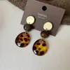 Pendientes Geométricos de Flor de Resina Transfronterizos Europeos y Americanos Otoplastias Maillard Otoño e Invierno Diseño Nicho de Gama Alta Joyería para Orejas Venta al por Mayor