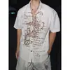 Atuendo Estilo Vacaciones Retro Americano Camisa de Manga Corta con Estampado de Cruz Desgastada Camisa de Punto Hueco para Hombre Verano