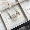 Colgante de Tubo Curvo de Cristal Imitación Ojo de Gato Nuevo Estilo Chino Fresco Tubo Curvo Nicho Hielo Translúcido Exquisito Temperamento Versátil Collar