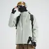 Chaqueta cortavientos de viaje color camello mismo estilo para hombre tres en uno desmontable forro polar de invierno engrosada cortavientos impermeable