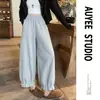 Pantalones grises cropped de estilo linterna para mujer petite, nuevo estilo primavera y otoño, con un look relajado y chic, caracterizados por un diseño de pierna ancha y una estética inspirada en Corea.