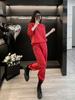 Traje casual de moda para mujer otoño nuevo popular rojo estampado suéter holgado de cuello redondo ropa de mujer de dos piezas este año