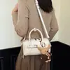 Otoño 2026 Nuevo Bolso Boston Simple de Alto Valor Estilo Coreano Moda de Nicho Elegante Bolso de Hombro Cruzado para Mujer