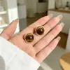 Pendientes de Ojo de Tigre Color Café Maillard de Lujo Ligero de Otoño e Invierno Más Vendidos, Estilo Vintage, Sensación de Alta Gama, Pendientes Simples y Accesorios para Orejas