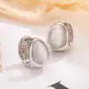 Brincos geométricos simples e compactos em formato de gota com pedra olho de gato, modernos e únicos, adequados para o dia a dia, com um toque de luxo, brincos femininos