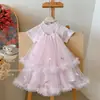 Conjunto de Verano para Niñas 2026 Estilo Nuevo: Moderna Camiseta de Manga Corta y Vestido con Tirantes de Malla Estilo Coreano para Niños Pequeños