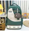 Mochila estilo nuevo 2026, transfronteriza, diseño minimalista, combinación de colores de moda, adecuada para estudiantes de secundaria, mochila de gran capacidad