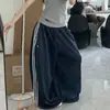 Pantalones Anchos Transpirables de Caída Fina para Mujer Verano Estilo Perezoso Rayas Parche de Cinta Cruzada Pantalones Casuales Transfronterizos Sueltos Largos