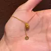Collar de Moneda Bolsa de la Suerte Cepillado Dorado para Mujer 2026 Nuevo Lujo Ligero Elegante Diseño de Nicho Cadena para Clavícula Joyería Personalización