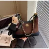 Bolso cubo único con patrón de diamantes para mujer, nuevo otoño 2026, moda vintage de alta gama, para hombro, cruzado y de mano