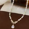 Collar de perlas naturales de agua dulce con forma de mariposa y circonitas para mujer, estilo nicho de alta gama, elegante y combinable con todo.