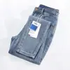 ¡Precio de Gran Venta! Artículos de Mostrador Textura Jeans Azul Claro para Mujer Nuevos de Alta Gama Cintura Alta Pantalones Ajustados 321