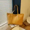 Bolsa de Gran Capacidad para Viajes Transfronterizos para Mujer 2026 Nueva Bolsa Tote Bolso de Hombro de Color Sólido Texturizado para Mujer Bolso Grande Tejido