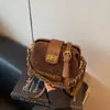 Bolso de cadena con patrón de rombos para mujer otoño 2026 nuevo diseño elegante de nicho bolso de hombro único cruzado sensación de alta gama bolso cuadrado pequeño