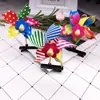 Nuevo pasador de molinillo de viento láser lindo borde actividades de promoción de microempresa barrido de código absorbente de polvo pequeños regalos premios de clase para estudiantes