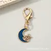 Llavero combinado de pentagrama calado y luna creciente transfronterizo, colgante de mochila de estrella y luna de esmalte colorido con cierre de langosta, accesorio pequeño