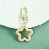 Nuevo llavero de pentagrama hueco de colores, accesorios de hebilla de puerta giratoria, materiales para accesorios de joyería hechos a mano DIY al por mayor