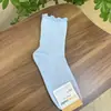 Calcetines de Algodón para Mujer de Primavera Temprana Color Sólido con Volantes de Longitud Media Importados de Dongdaemun Kikiya Corea Venta al por Mayor