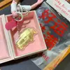 Llavero de casa de coche de oro 999 ticket llave oro 20mg colgante para teléfono móvil adornos tarjeta de felicitación regalo a mano