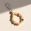 Raíz de Bodhi Cuentas Redondas Gato Asado Carbón Uña de Gato Lanyard para Teléfono Móvil para Mujeres Exquisito y Lindo Gato de la Suerte Corto para Muñeca Colgante Antiperdida Venta al por Mayor