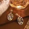 Falda de Moda con Estampado de Leopardo, Aretes en Forma de Corazón, Estilo Vintage Dorado, Joyería Transfronteriza Creativa Clásica de Nicho