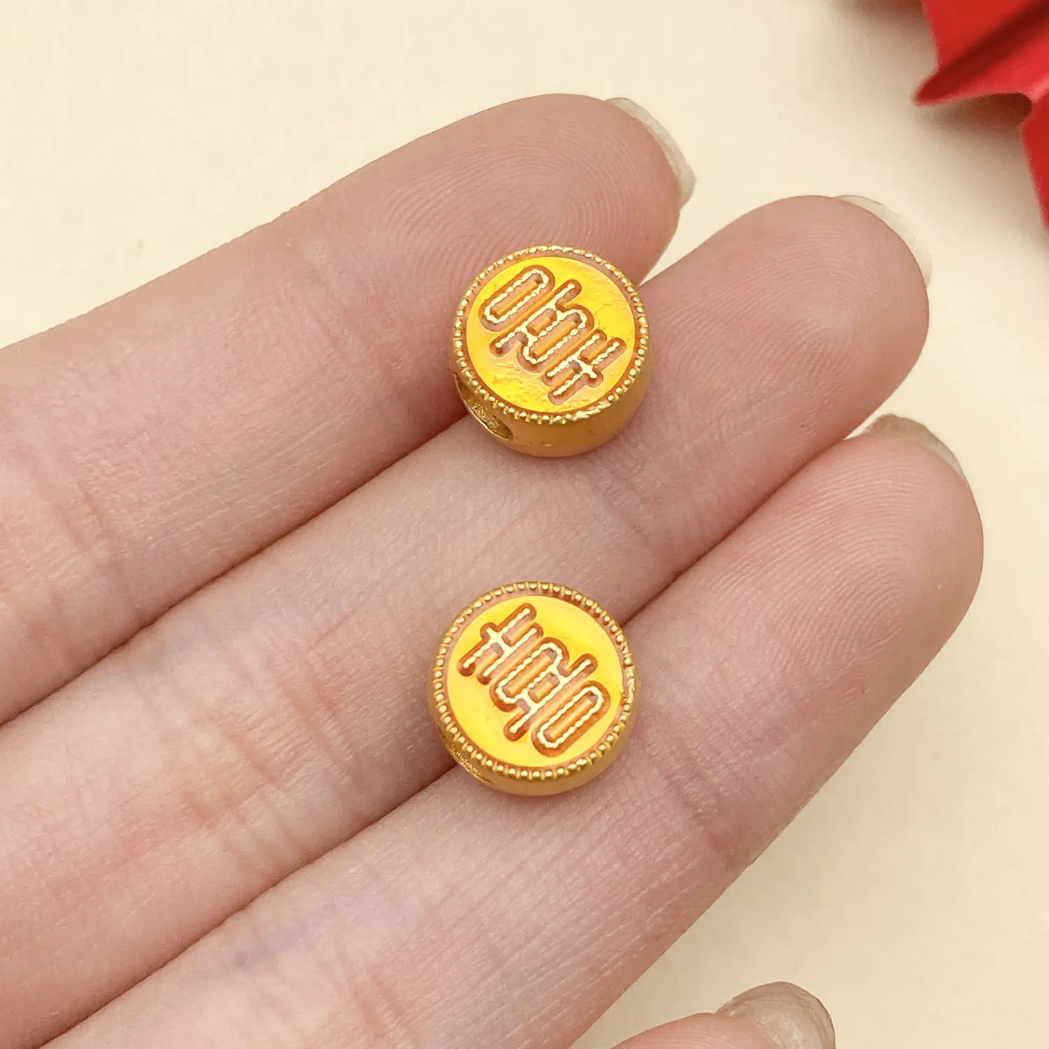 22677-ZY2-黄色滴油亮金双面横孔喜字间隔珠7x6mm