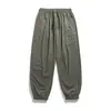 Yidao Vintage 2026 Primavera Novo Japonês Retrô Simples Cor Sólida Bolso com Zíper Solto Casual Calça Jogger para Homens