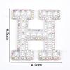 Venta caliente transfronteriza de 26 pegatinas de tela con forma de estrella de cinco puntas y letras de perla para ropa, sombreros y bolsos, materiales decorativos.