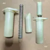 Peças de máquinas têxteis Peças de retorcedeira Peças de grande bobina Dongxing Lilai Suporte limitador Assento da mola Mola de tubo branco