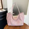 Bolso de mano a rayas de alta gama transfronterizo 2026 nuevo bolso versátil de hombro o axila bolso tote relajado de gran capacidad