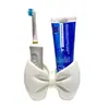 Portacepillos de dientes con forma de lazo, organizador de escritorio para cepillo de dientes eléctrico y pasta de dientes, estante de almacenamiento para tocador de baño, artículo decorativo