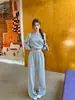 Traje coreano para mujer Otoño e Invierno Tops de manga larga holgados en la cintura Hombros descubiertos Hombro inclinado Sudaderas Pantalones casuales de pierna ancha