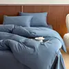 Nuevo juego de cuatro piezas de algodón 100% de color liso, alta densidad de hilos, algodón de fibra larga, engrosado y cepillado, funda de edredón simple para otoño e invierno, colcha y sábana bajera al por mayor