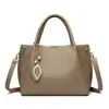 Bolso de mano para mujer 2026 nueva moda simple para mamá de mediana edad bolsa de gran capacidad multi-compartimento cuero suave bolsa para el día a día