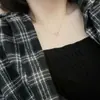 Moda simple pequeño fresco hueco colgante de amor collar para mujer versátil ins cadena de clavícula en forma de corazón alta calidad al por mayor