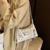 Textura de nicho color retro bloque de color lunares 2026 otoño nuevo elegante simple gran capacidad versátil bolso de hombro cruzado